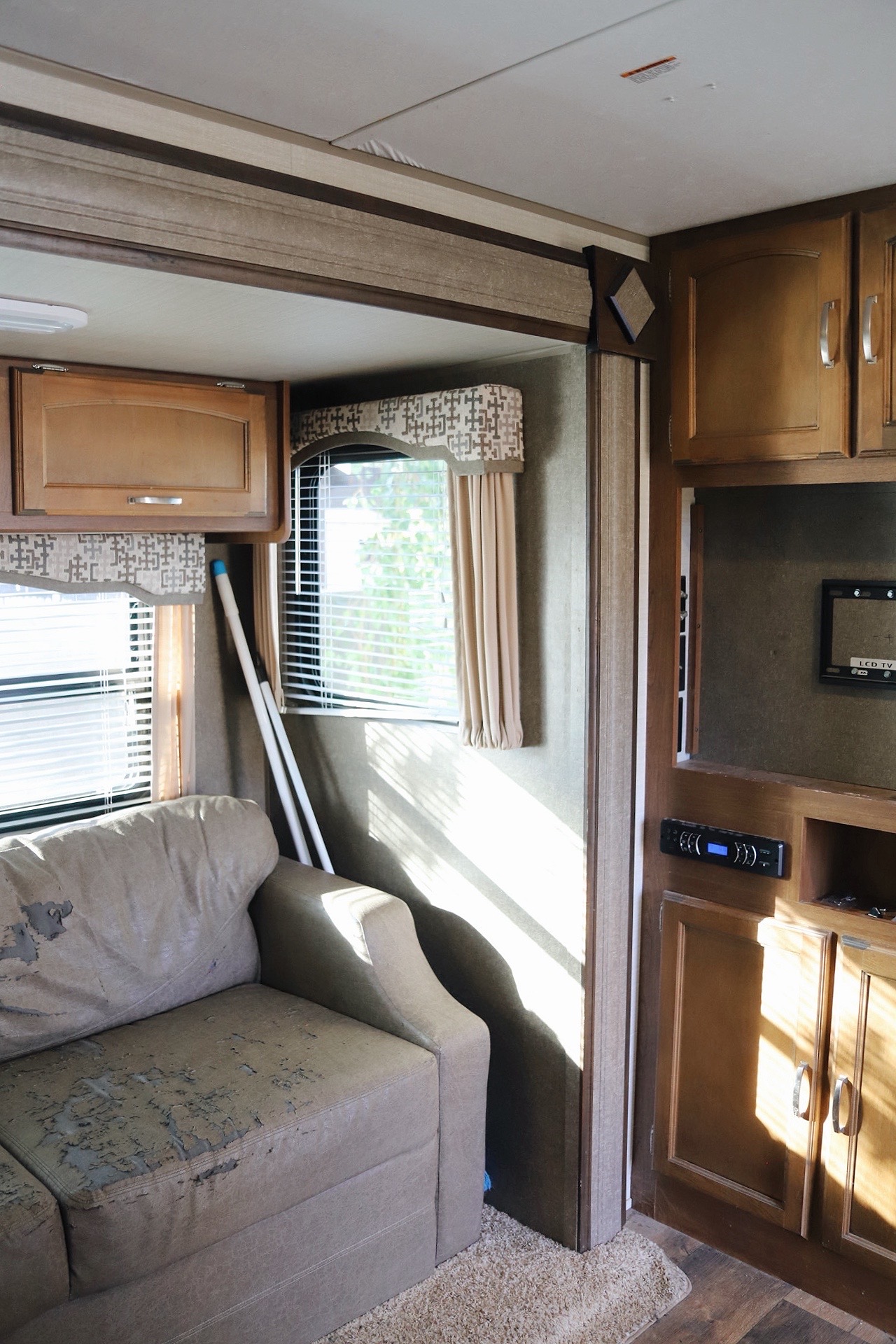 RV Couch and Entertainment Center Before